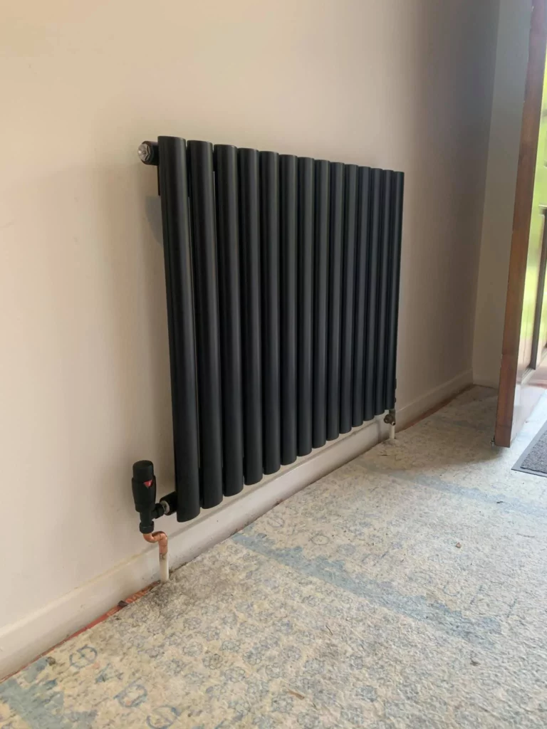 Modern vertical radiator installation hja heating